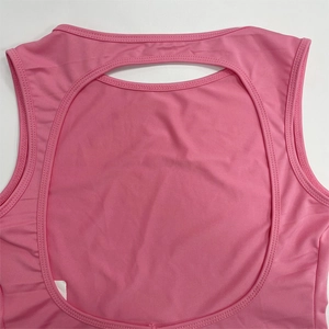 Detailed view of pink vacation set featuring a sexy backless circular cutout design