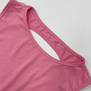 Detail of pink high-elastic fabric featuring cutout design and precise double-stitch edges