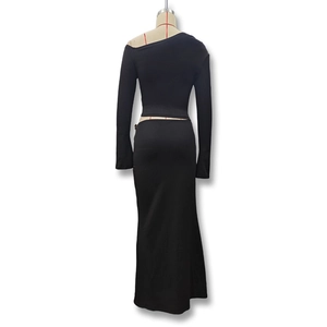Rear view detail of black two-piece set featuring off-shoulder top and high waist maxi skirt