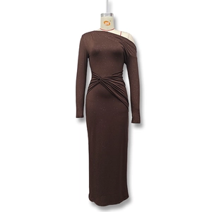 Detail of glitter fabric texture and ruched waist on a brown one-shoulder dress