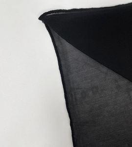 Close-up of the breathable black mesh fabric and high-quality edge stitching detail