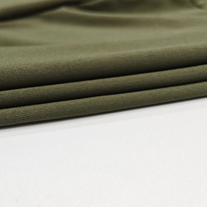 Detailed view of dark olive green knit fabric texture with soft ribbed patterns