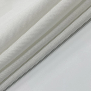 Close-up of white high-density woven fabric showing detailed texture and drape