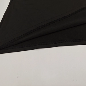 Detailed close-up showing high-density knitted fabric and neat double-needle stitching