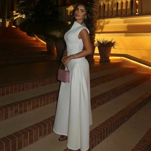 Elegant white sleeveless high-neck evening gown with side draping and floor-length A-line cut