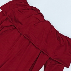 Close-up of dark red off-shoulder dress featuring premium ribbed knit texture and folded neckline