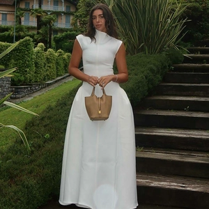 Elegant white sleeveless high-neck maxi A-line dress with minimalist design style