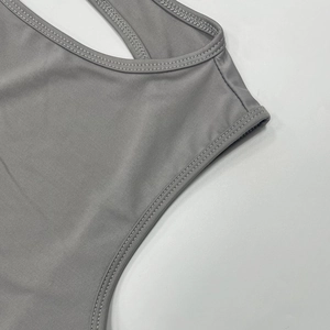 Close-up of light gray knitted tank top showing high-quality double-needle edge stitching