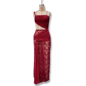 Detail of burgundy evening gown showing lace paneling and side drapes in high quality fabric