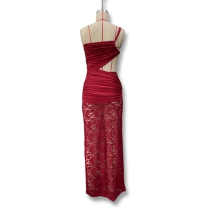 Detail of burgundy lace dress with pleated bodice, waist cut-outs and floral embroidery