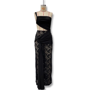 Detail of elegant black lace dress featuring shoulder drapes and hollow-out waist design