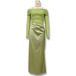 Detail of off-shoulder grass green maxi dress featuring elegant side ruching and pleats