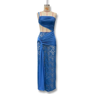 Detail of blue lace dress featuring waist cut-out and elegant cascading ribbons