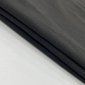Vue détaillée de la texture du tissu en maille gris foncé de haute qualité et fibres douces