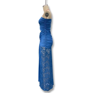 Detail view showing blue ruched bodycon dress texture and floral lace splicing design