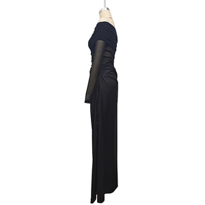 Detail of off-the-shoulder long sleeve dress featuring sheer mesh sleeves and ruched texture