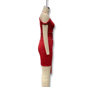 Detail view of red off-shoulder crop top and bodycon skirt set on mannequin