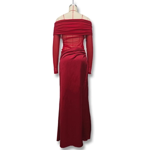 Detail of red off-shoulder maxi dress with mesh panels and elegant pleated neckline