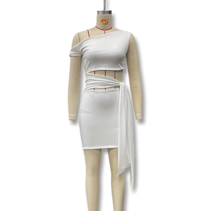 Detail of white mini dress featuring asymmetrical cut-out waist and draped tie ribbon fabric