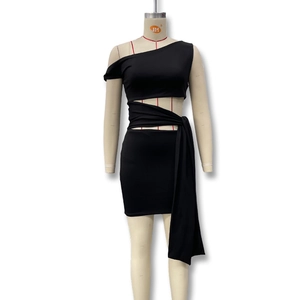 Detail of black one-shoulder dress with sexy waist cutout and wrap-around ties