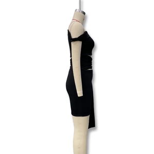 Detail view of black off-shoulder two-piece set with side slit and bodycon skirt fit