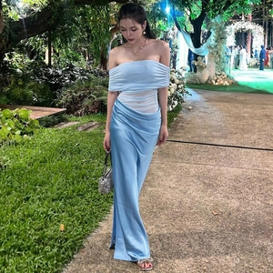 Detail of elegant light blue satin off-shoulder dress with draped pleated design