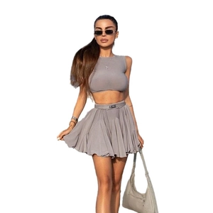 Gray two-piece summer set with backless crop top and high-waisted pleated mini skirt