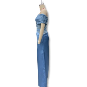 Side view of light blue satin dress featuring pleated bustier and sleek long silhouette