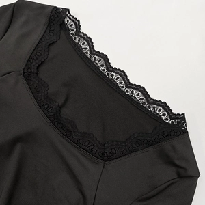 Detail of elegant black lace trimming on a sophisticated square neckline women top