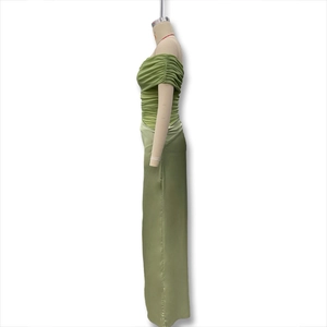 Detail of sage green off-shoulder dress with mesh pleats and satin texture fabric