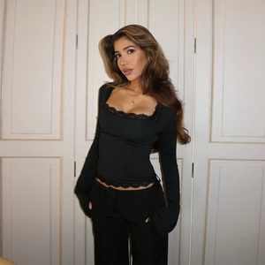Slim fit black long sleeve top with square neck and delicate lace trim for women