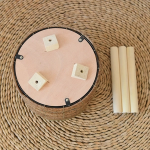 Detail of detachable solid wood legs and hand-woven rattan base for balcony plant stand