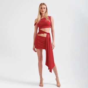Detail of red hollow-out cut-out dress with slim fit side tie and elastic fabric