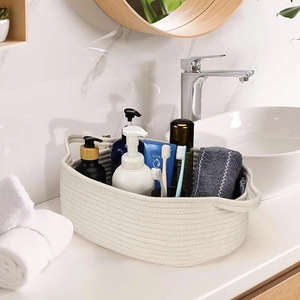 Handwoven cotton rope storage basket with handles for bathroom toiletries organization