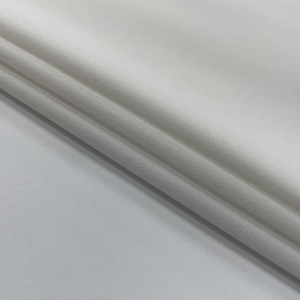 Makro-Detail von hochwertigem weißem Leinwandgewebe mit weicher Textur und dichtem Strick