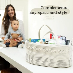 Detail of white cotton rope diaper caddy storage bag showing woven texture and capacity