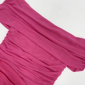 Detailed macro view of the ruched fuchsia mesh fabric showing texture and layers