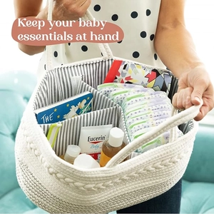 Detail of cotton rope baby diaper caddy showing interior striped lining and storage dividers