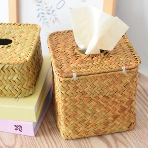 Detailed view of hand-woven natural seagrass tissue box with secure side buckle closure