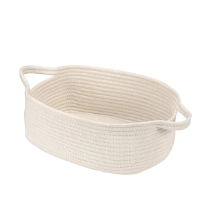 Handwoven cotton rope storage basket with handles in cream white for home organization