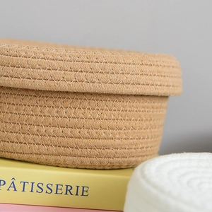 Detailed close-up showing the cross-stitch weaving of this khaki cotton rope storage basket