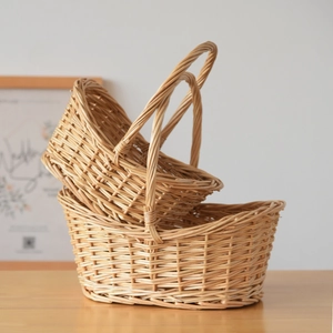 Detail showing handwoven texture of natural wicker basket with handle in two sizes