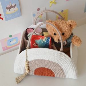 Woven cotton rope baby diaper caddy with rainbow embroidery and wooden bead tassel