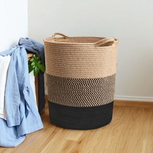 Detail of a large Nordic cotton rope basket with triple color block stitching and handles