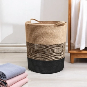 Detail of three-color gradient woven storage basket with dual handles in home setting