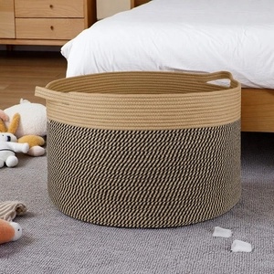 Detail of Nordic cotton rope laundry basket with dual-tone design and side handles