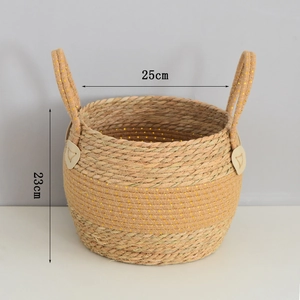 Detail of seagrass woven basket with golden threads and 25cm diameter dimension label