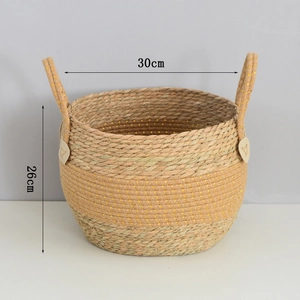 Detail of seagrass basket with leather heart buckles and golden thread weaving texture