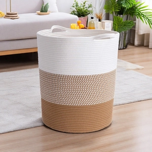 Detail of woven cotton rope storage basket with three-tone color design and sturdy handles