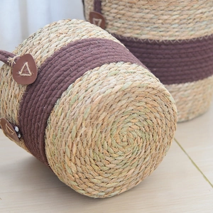 Detailed macro view of spiral woven straw bottom and decorative dark brown cotton rope